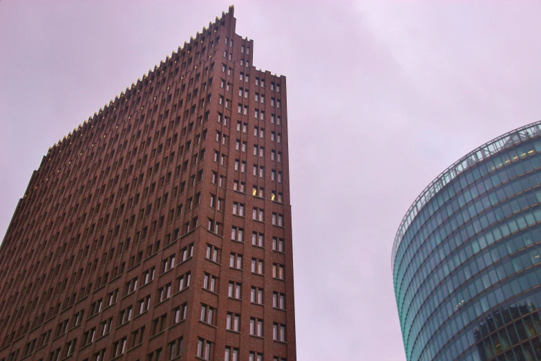 a building with glass windows near another building