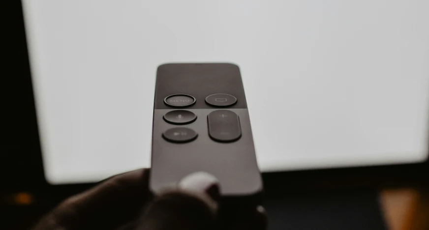 closeup s of someone holding a remote control