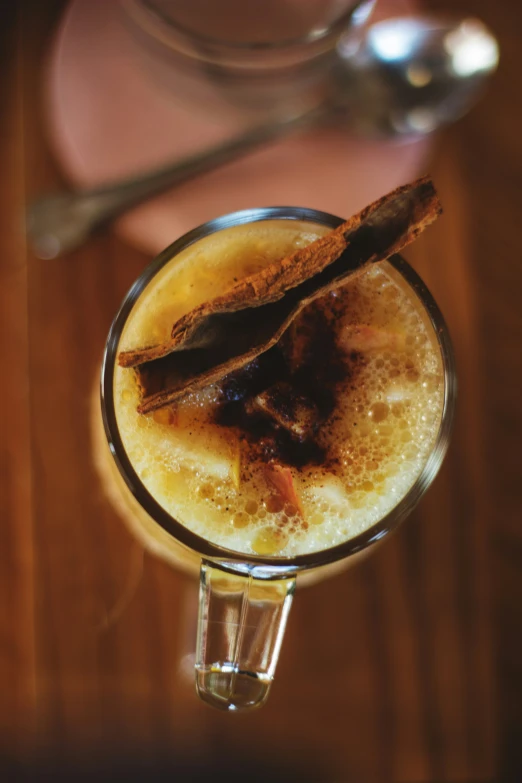 a close up of a drink with spices in it