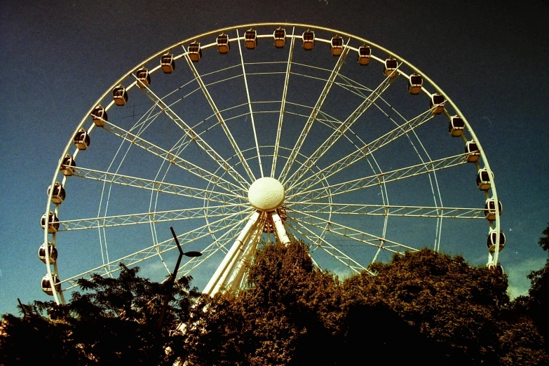 an amut ferris wheel that is being operated at the park