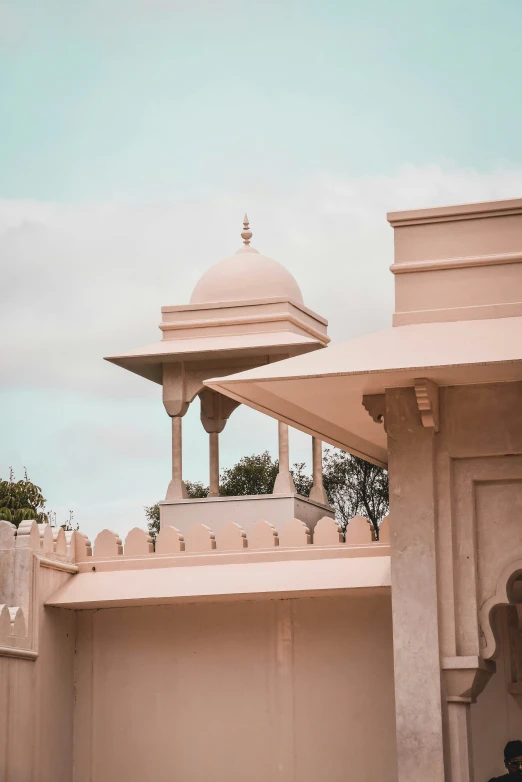 an intricately decorated and white building has arches