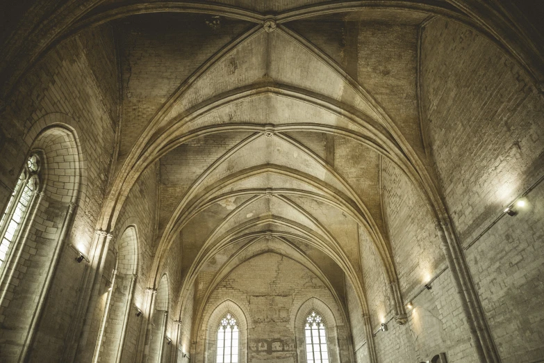 an old church with very tall ceilings and stained glass windows