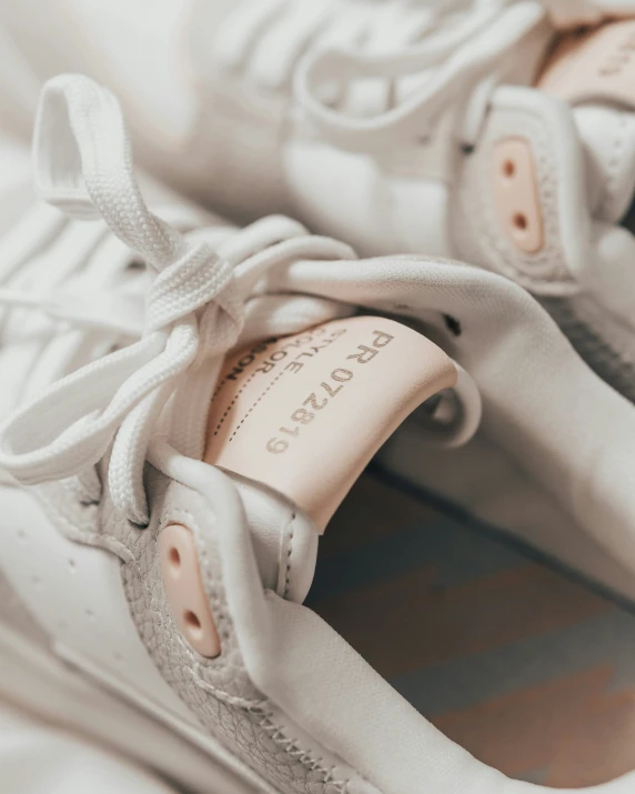 a pair of shoes is seen sitting on the bed