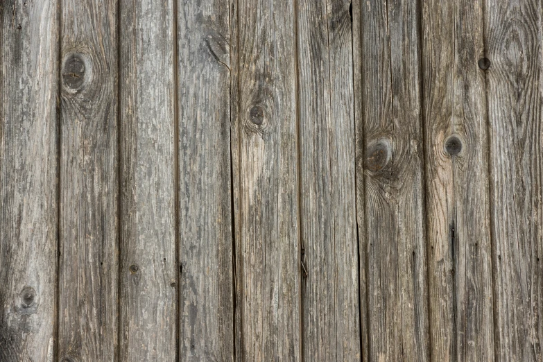 an old wooden fence with many planks
