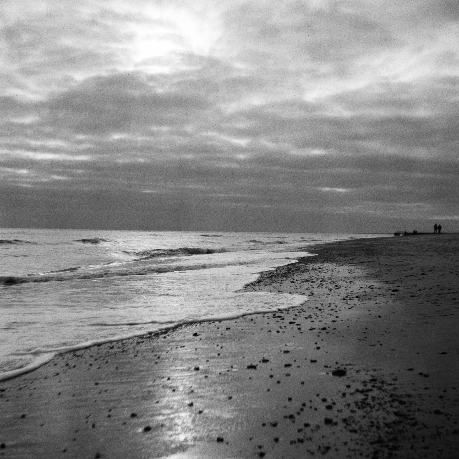 an ocean beach with waves crashing onto the shore