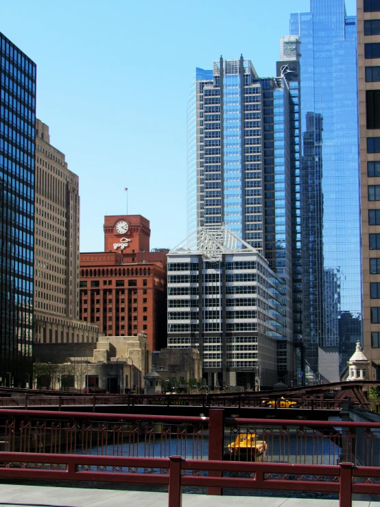 large tall buildings in a city next to a river