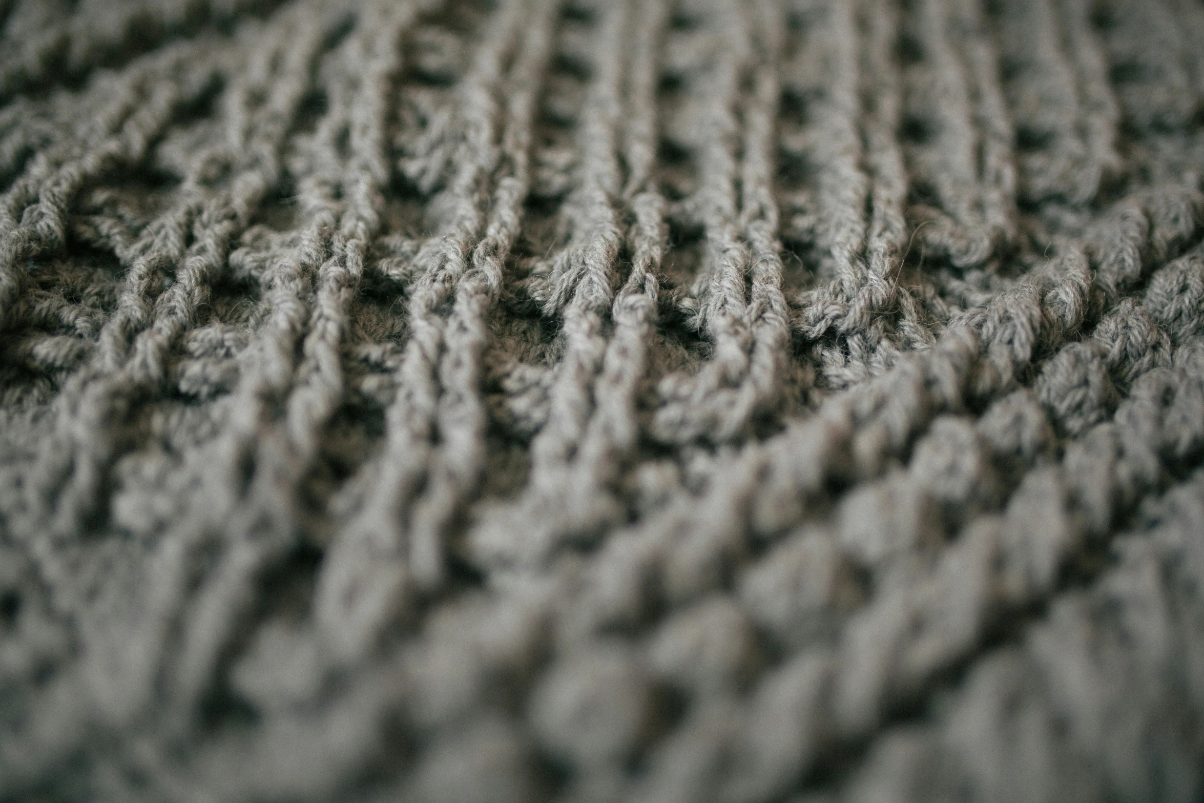 a close up po of a textured, crochet fabric