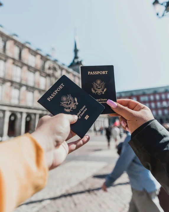 a person holds out a two - way passport for another person