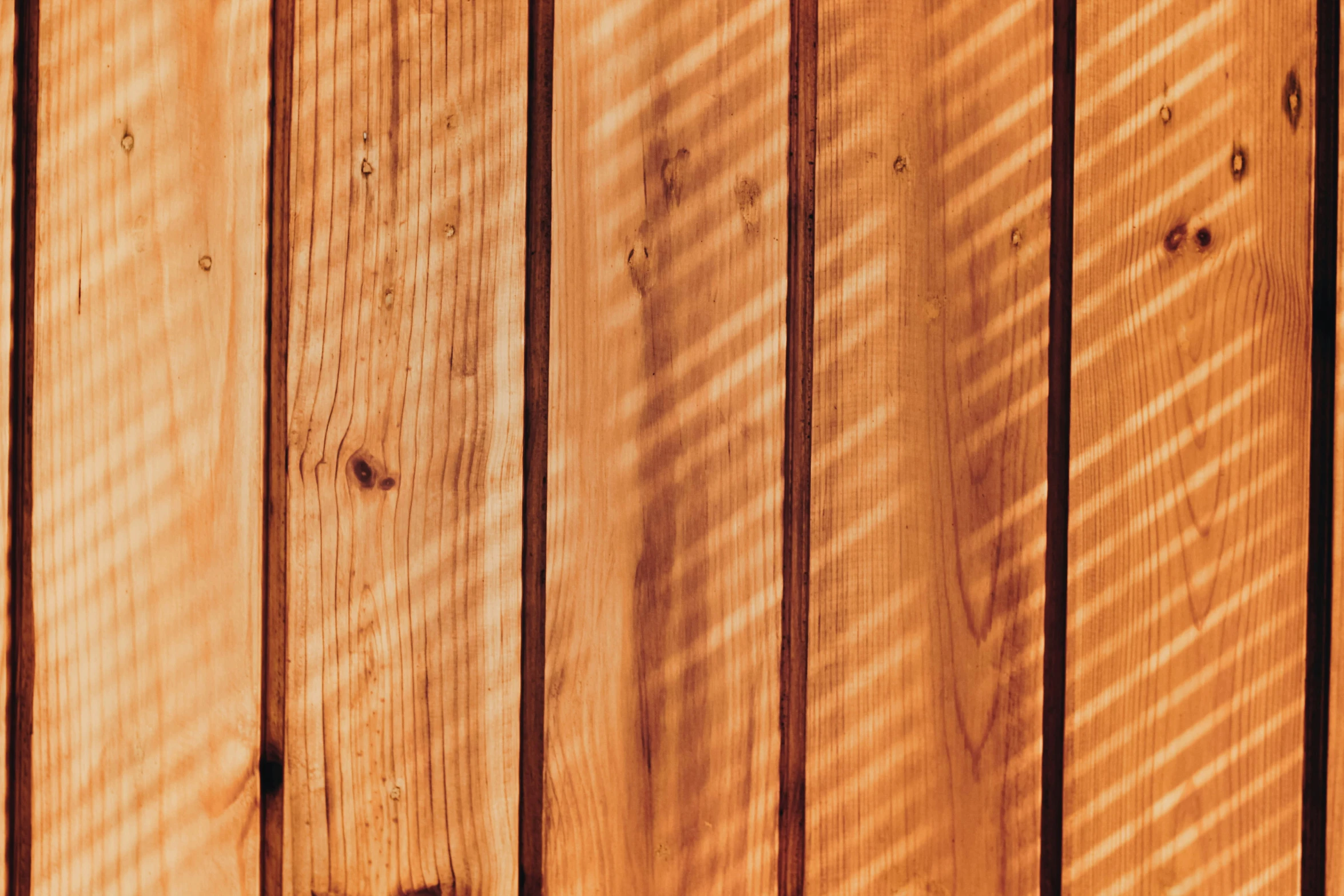 an orange colored wall with several horizontal lines