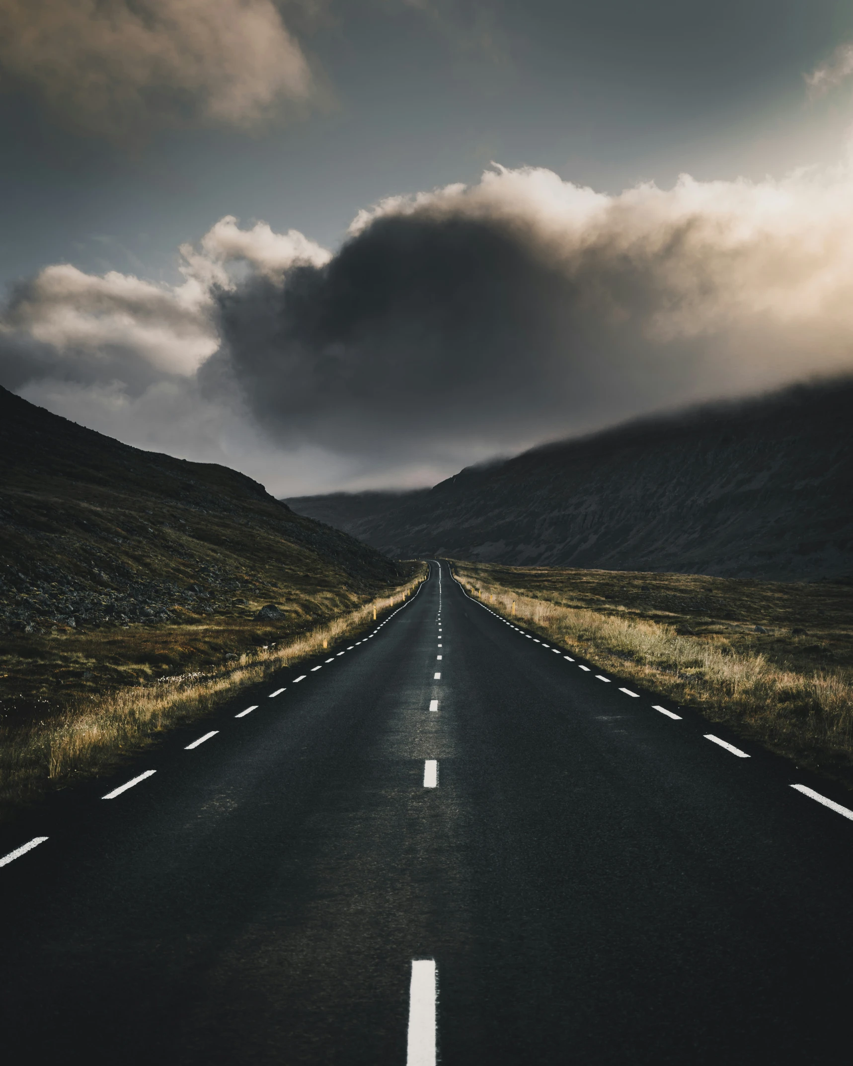 the view from the bottom of a long straight road