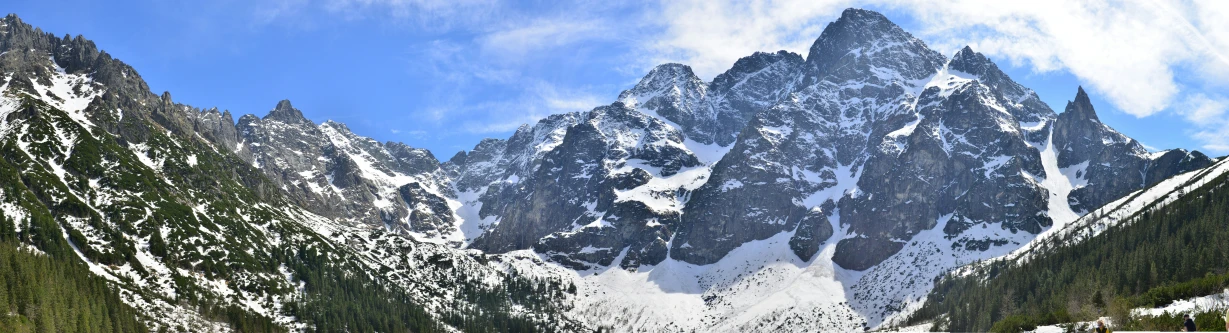 some very tall mountains in the winter