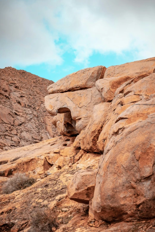 rock formations on an empty mountaintop with sky in background