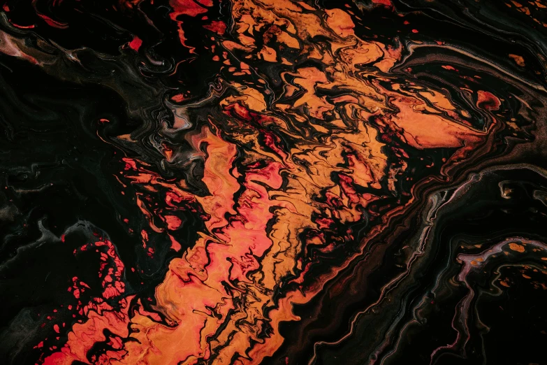 this is an image of a black, orange and red liquid painted surface