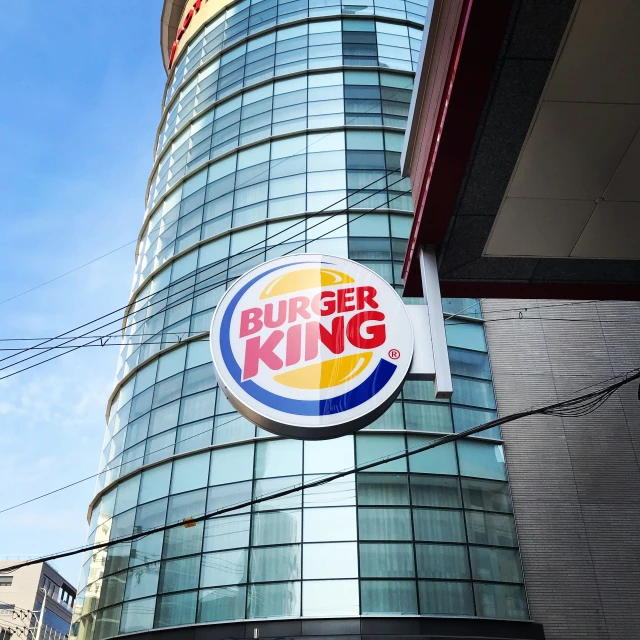 a large burger king sign on the side of a building