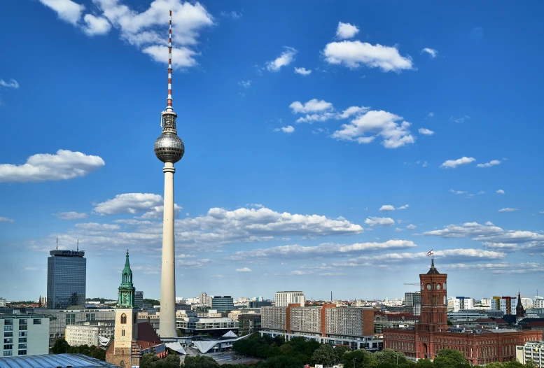 a very tall tower towering over some buildings