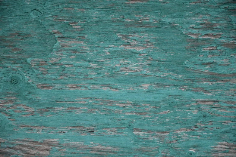 a wood surface with peeling paint and a wooden board
