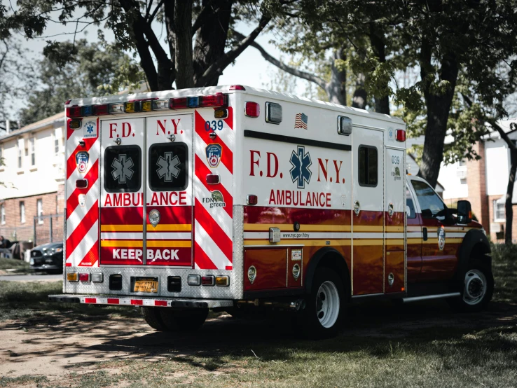 an ambulance parked in the yard during the day