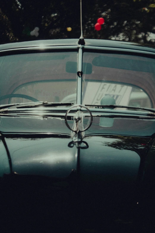 an old car that is parked on the street