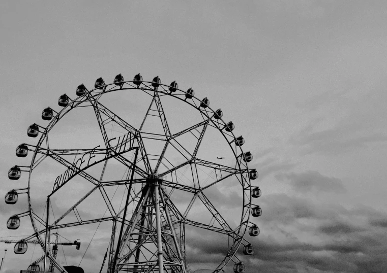 a black and white po of a ferris wheel