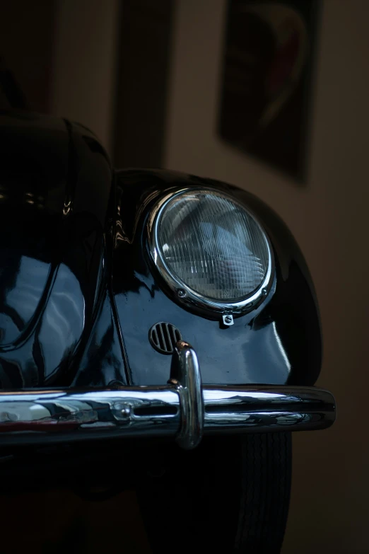 a black antique car is shown in the dark