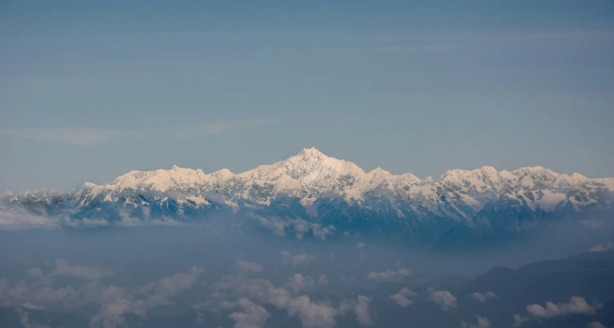 a view of a mountain on an airplane