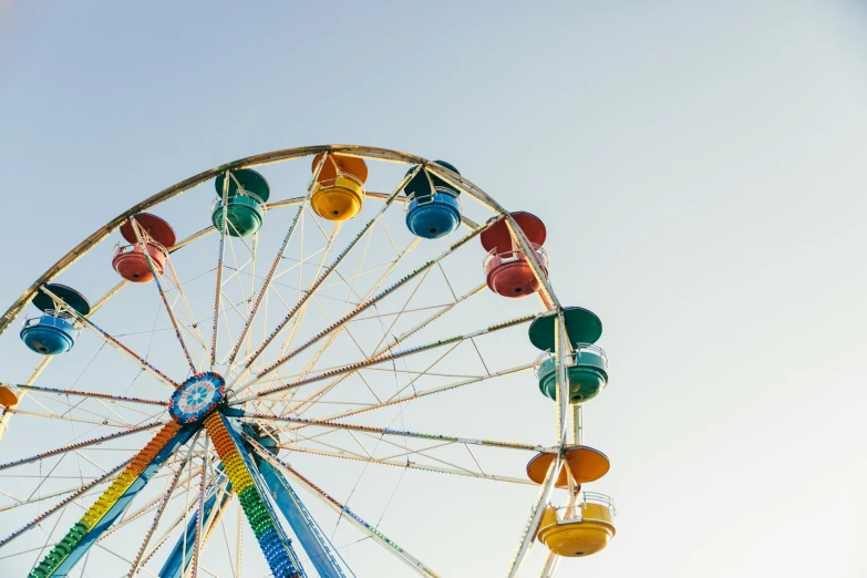 a big wheel with some cars driving on it