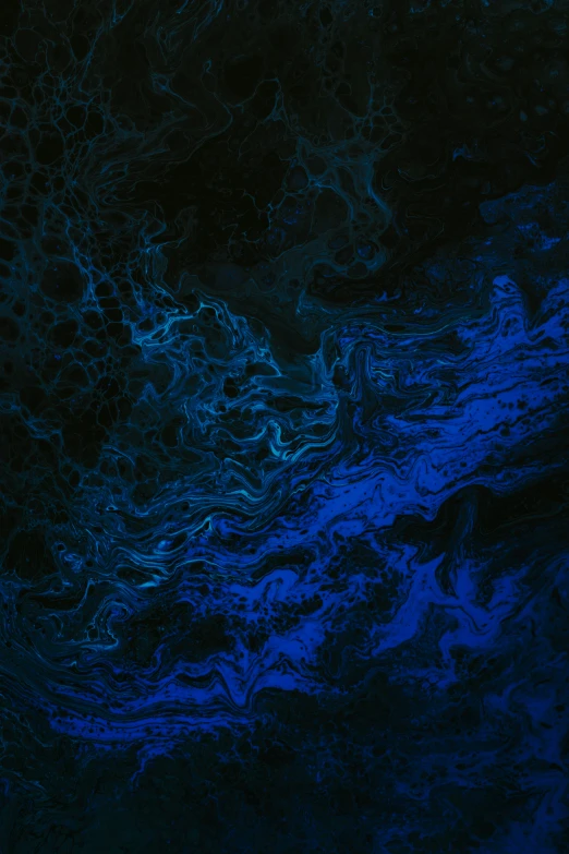 a po looking down at dark blue swirls