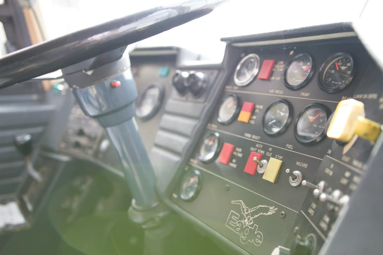 the control panel of an old plane in a hangar