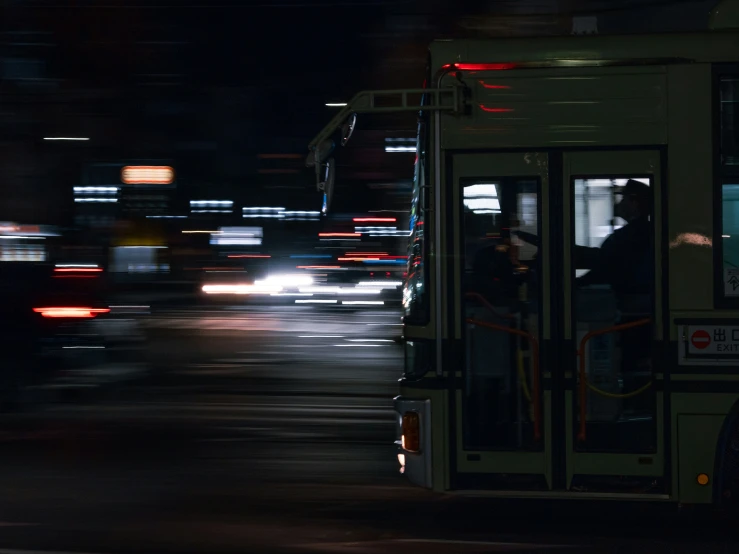 two people on a bus with motion blurry in the background