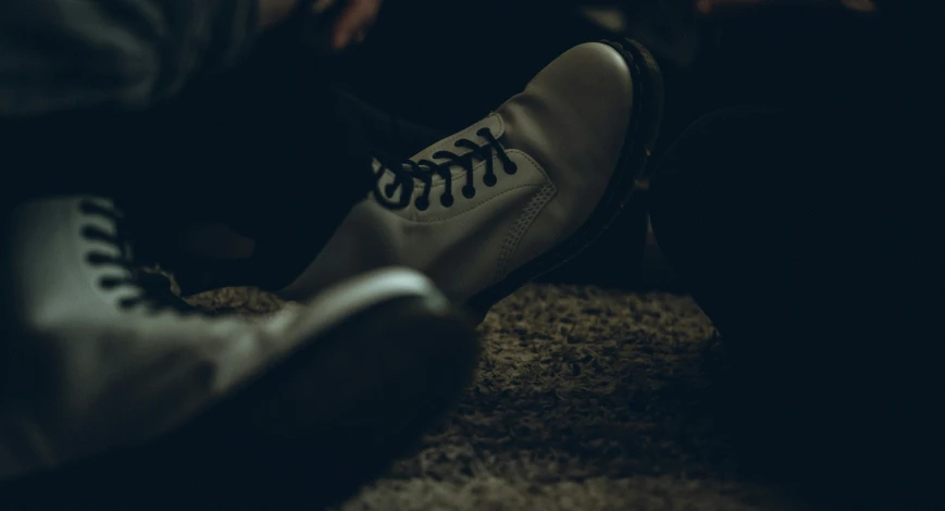 a couple sitting in a circle on the floor