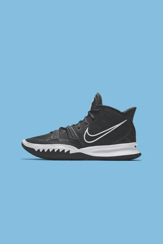 a black nike basketball shoe with white accents on the side