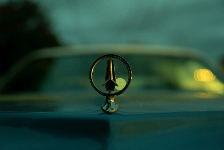 a close up view of a car emblem on the hood