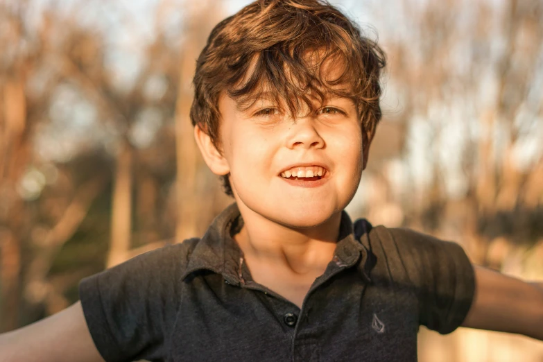 an adult with a blurry image of a boy laughing