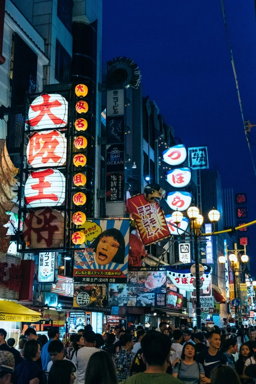 many people are standing in the middle of a street