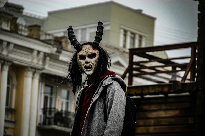 a man wearing horned horns and a mask