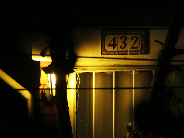 a street sign on a dark street corner at night