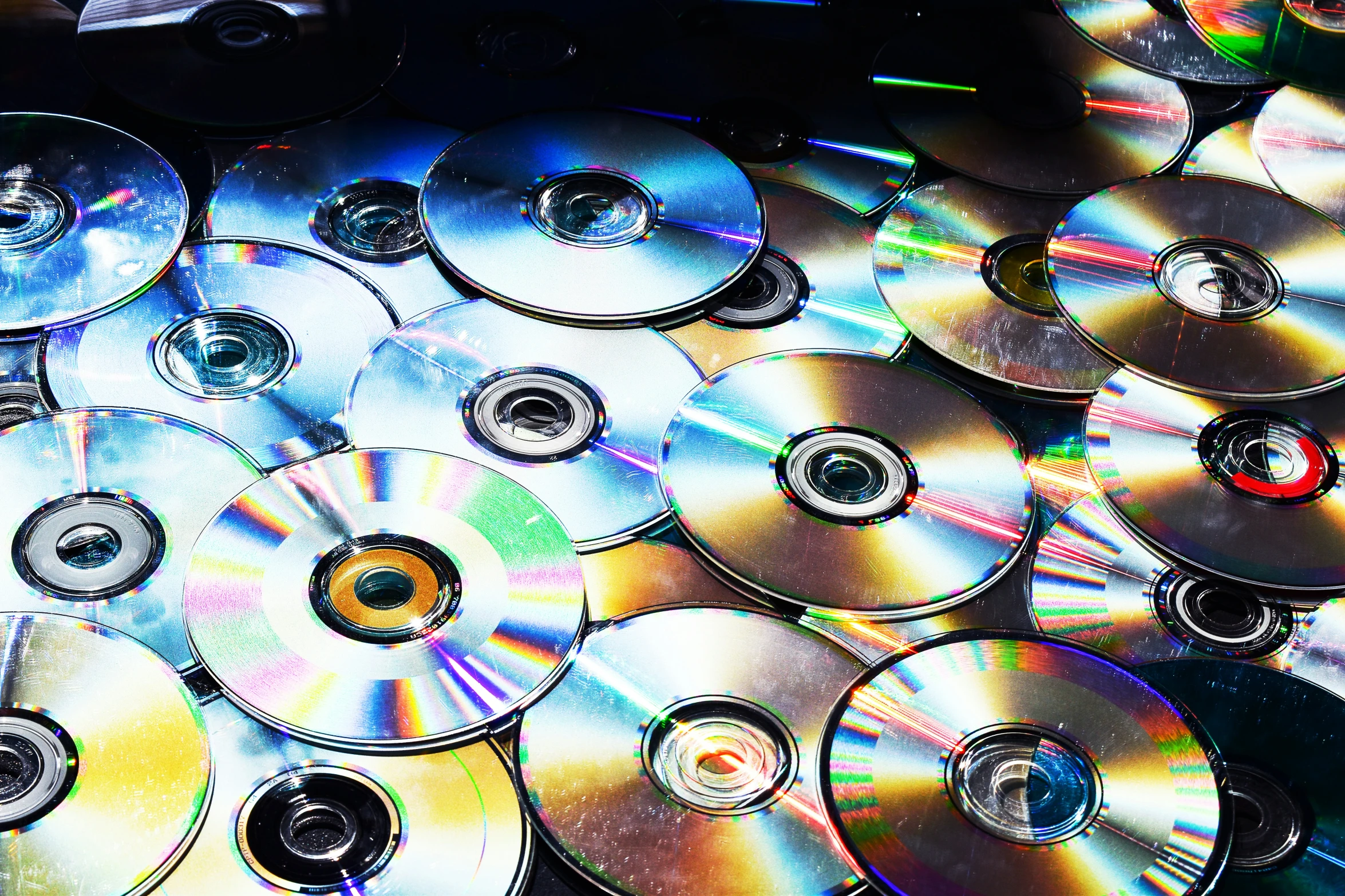 a close up of many dvds on a table