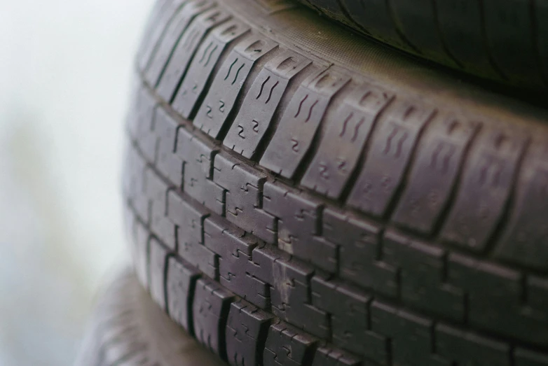 four new tires piled on top of each other