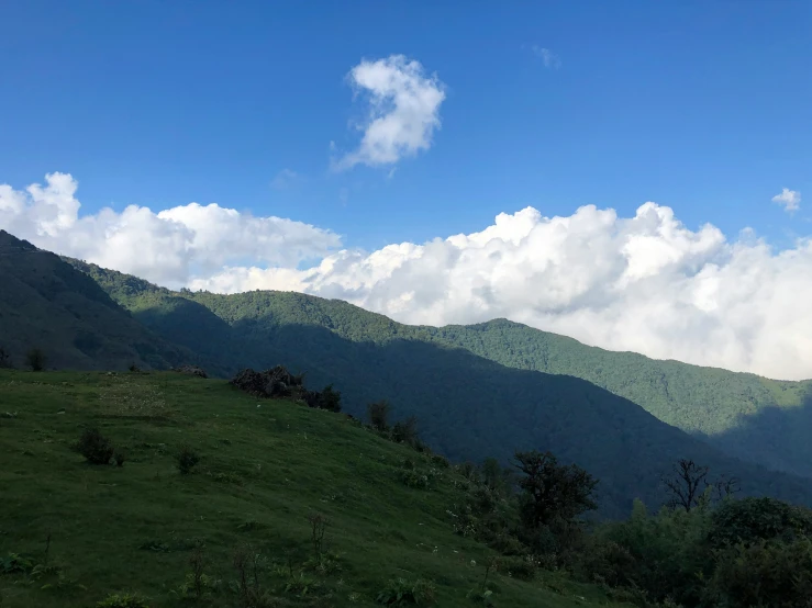 clouds and the mountains in this countryside are very tall