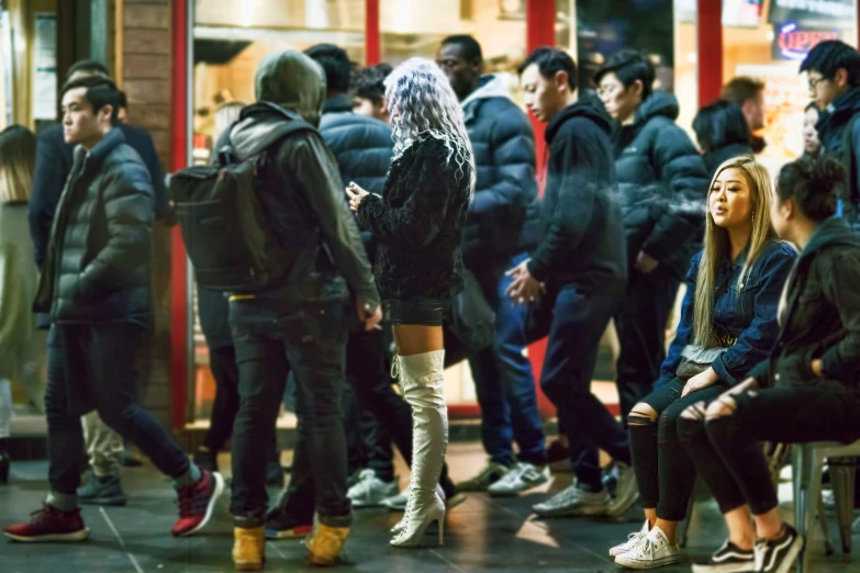 many people waiting for their subway train at the station