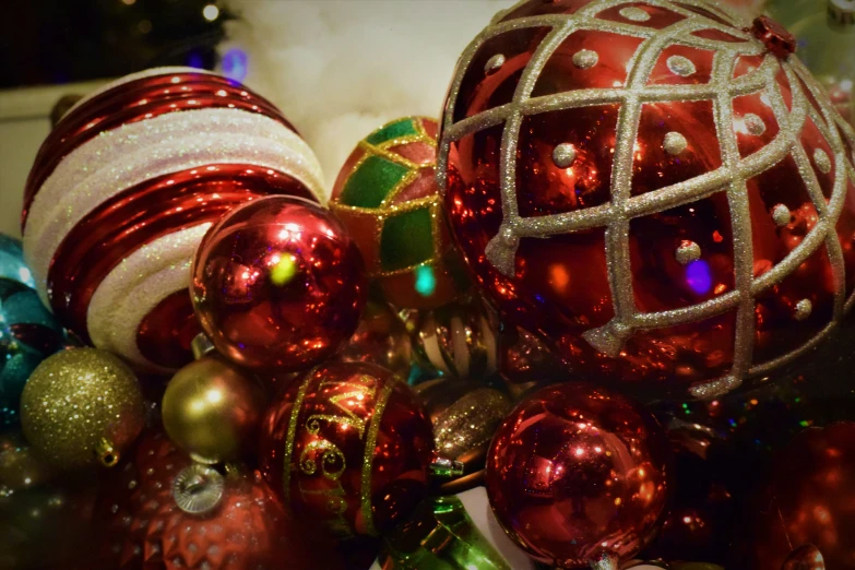 many shiny ornaments scattered together on a table