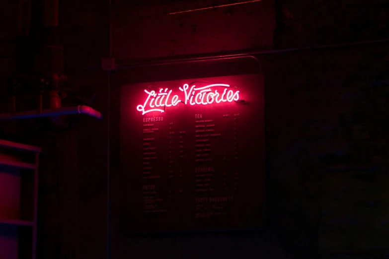 a sign lit up with the words little nations