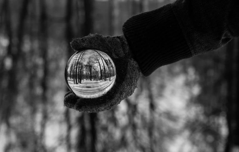 a man is holding out his hand to the snow covered ground