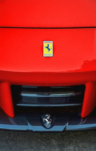 a bright red car with the emblem of an emblem