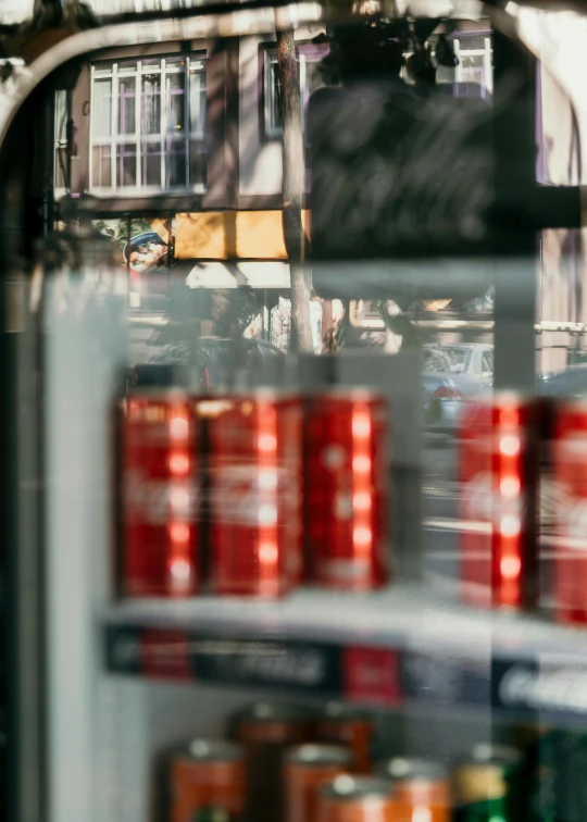 a shelf has cans of beer on it