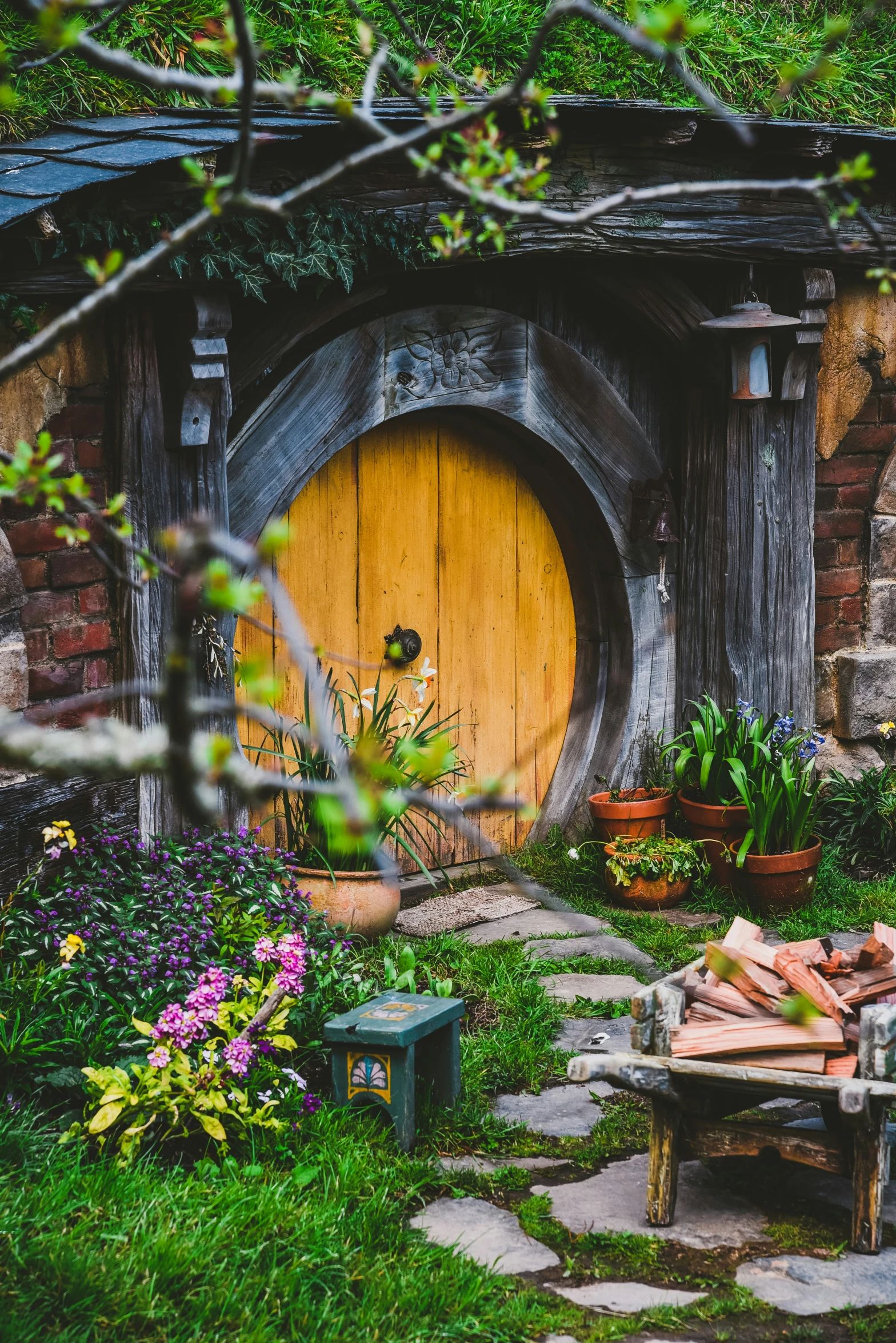 there is a hobbot at the entrance to a small garden