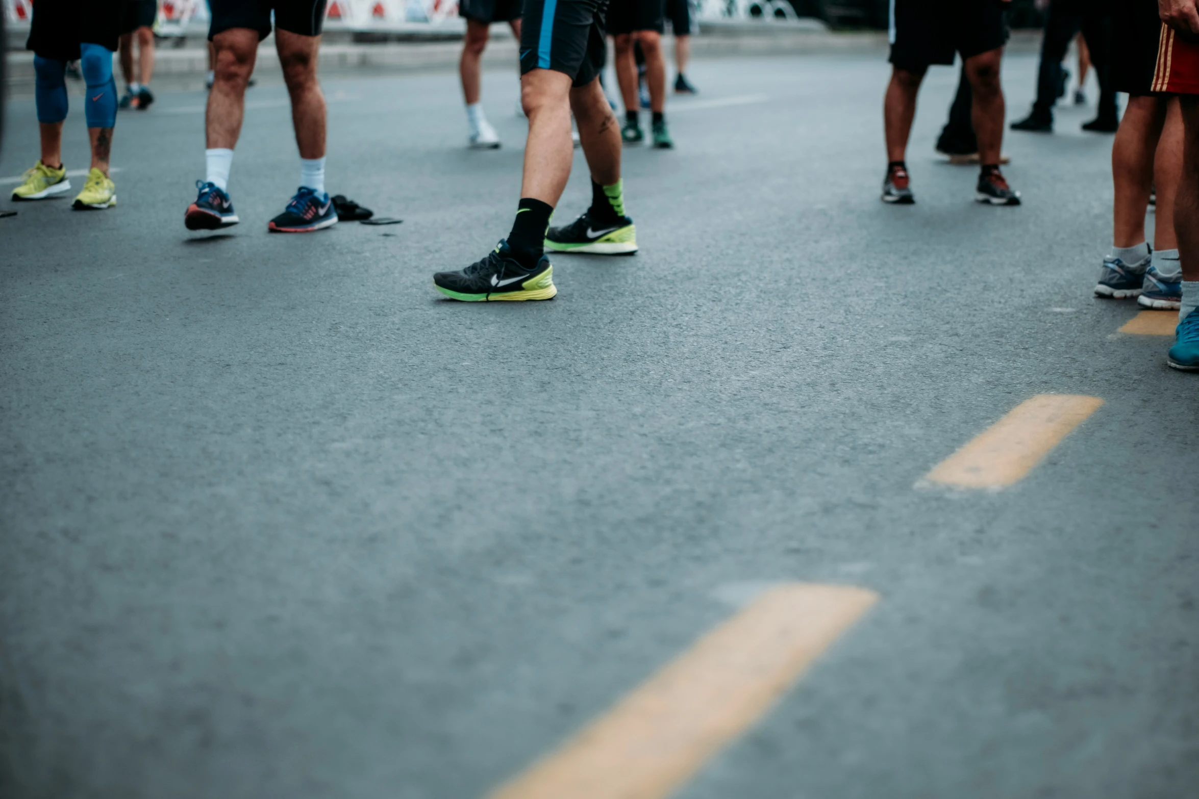 a close up s of a person's feet with his running shoes still on