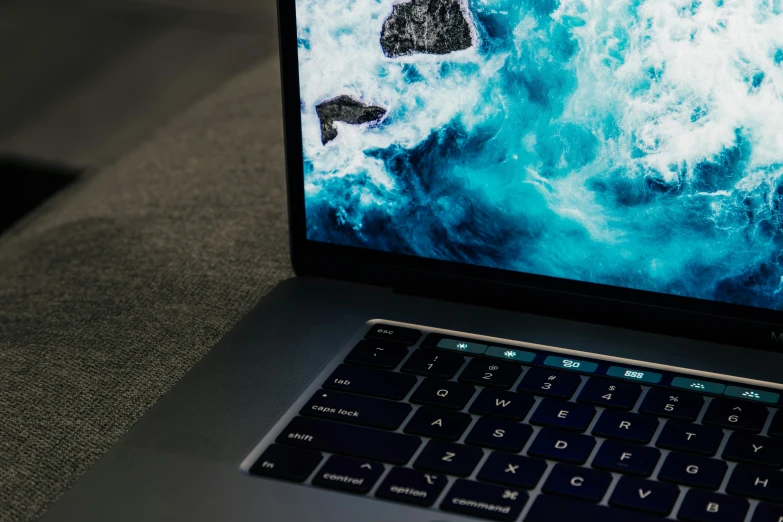 a laptop with a blue keyboard on top of it