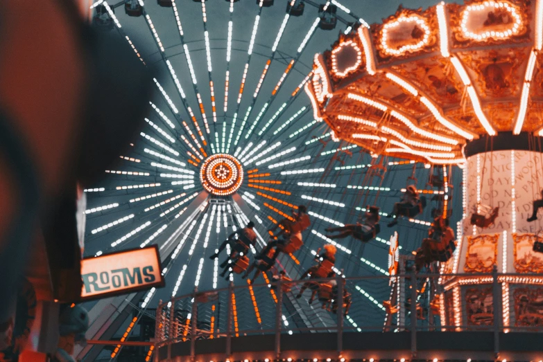 a carnival rides wheel during a night time event