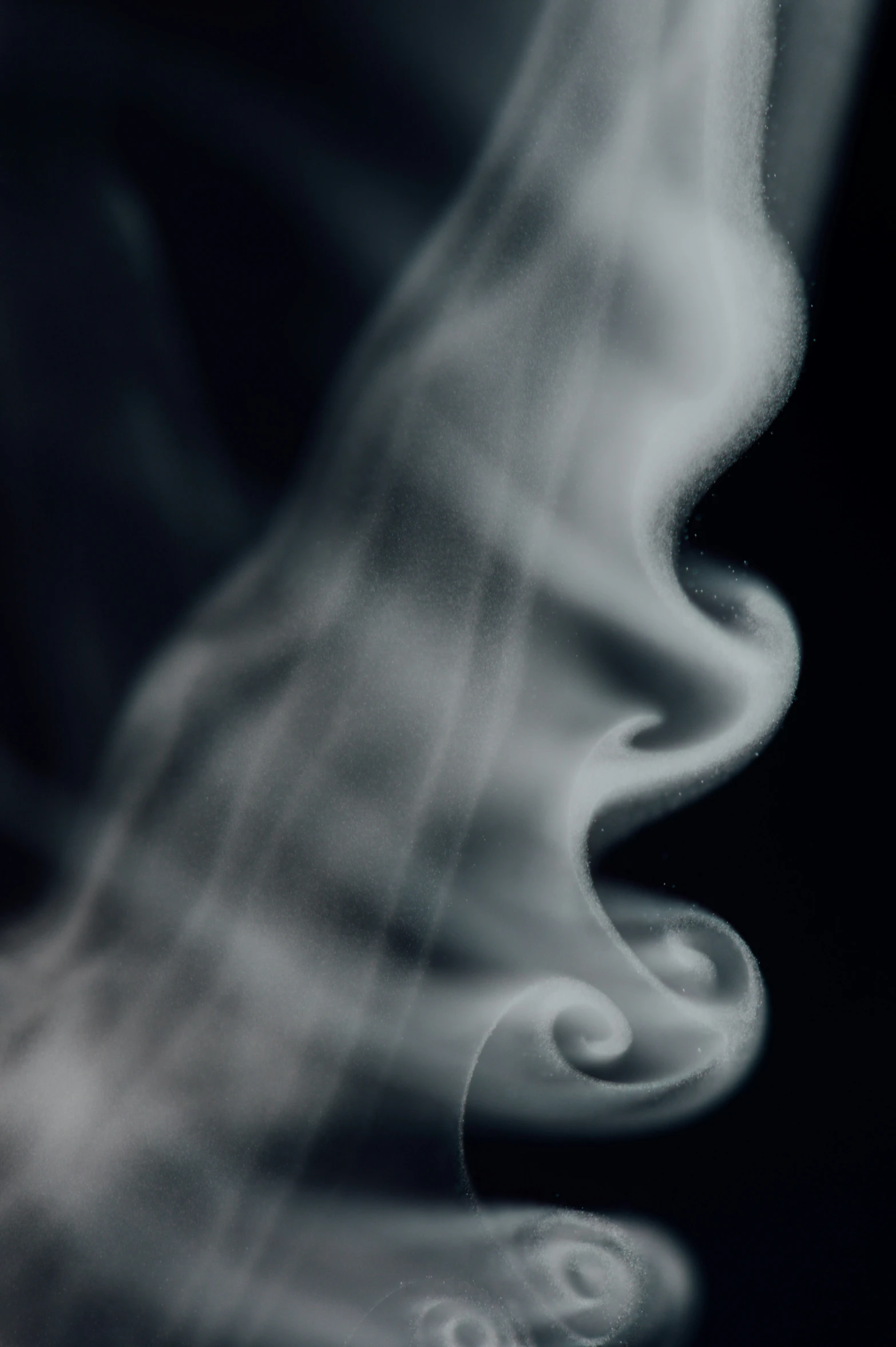 white smoke on the black surface